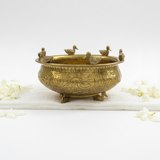 The Brass Duck Uruli is a cultural artefact and decorative metal bowl that serves as a standalone art piece and conversation starter, bringing traditional charm and timeless beauty to your home.